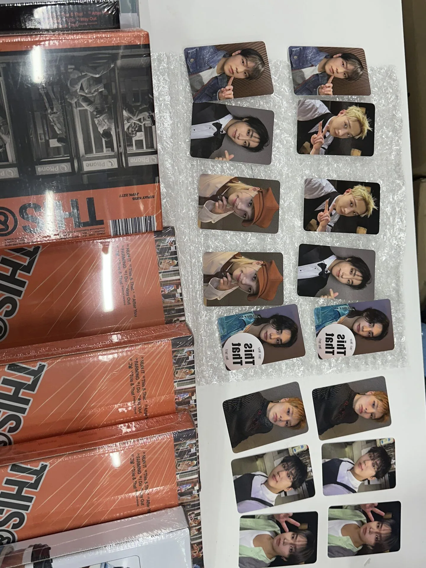 Red K-pop albums arranged together during an arrival inspection